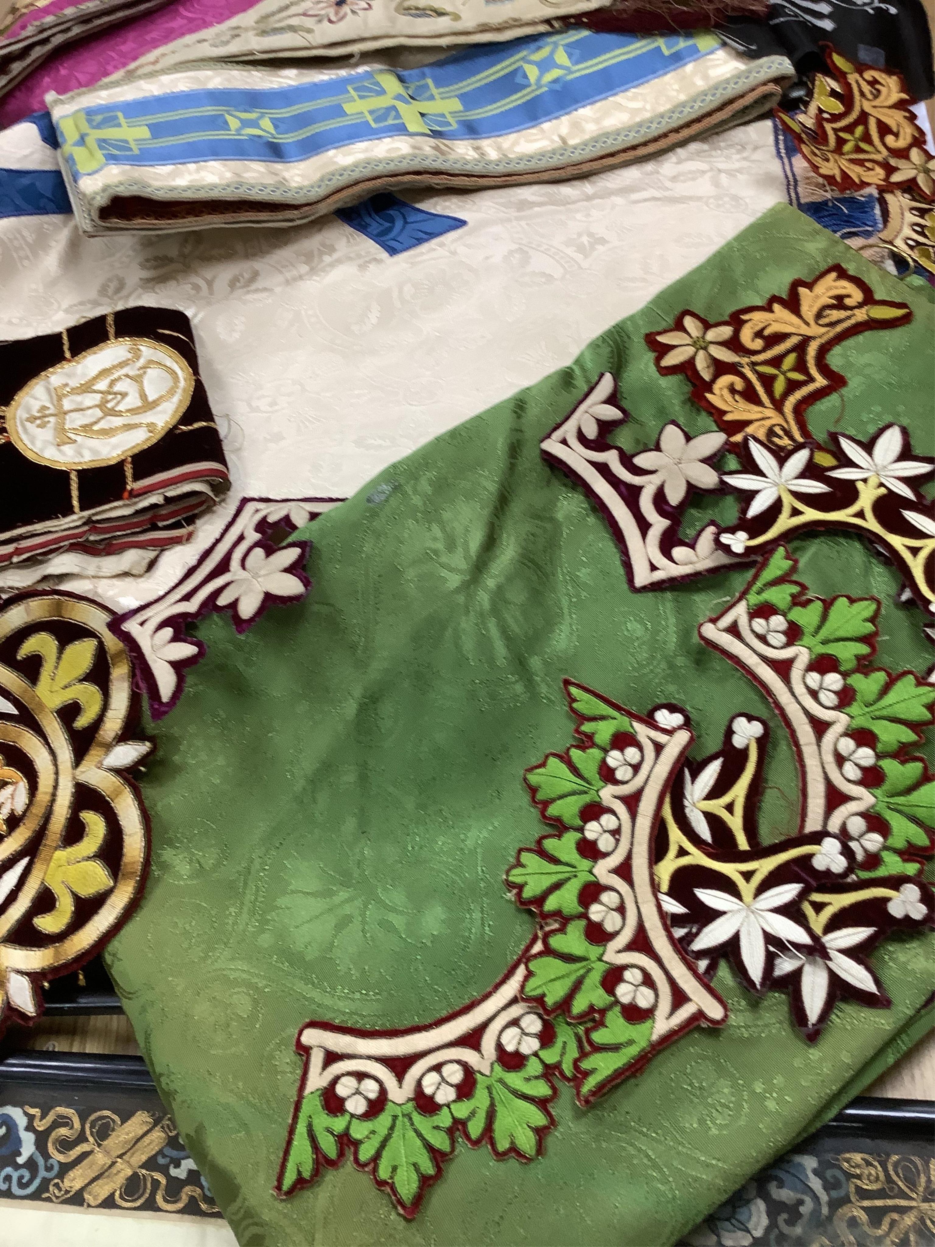 A collection of 20th century reversible coloured damask liturgical church hangings, together with a 19th century polychrome and gold embroidered cream silk stole with fringed ends. - 220cm long and a small collection of
